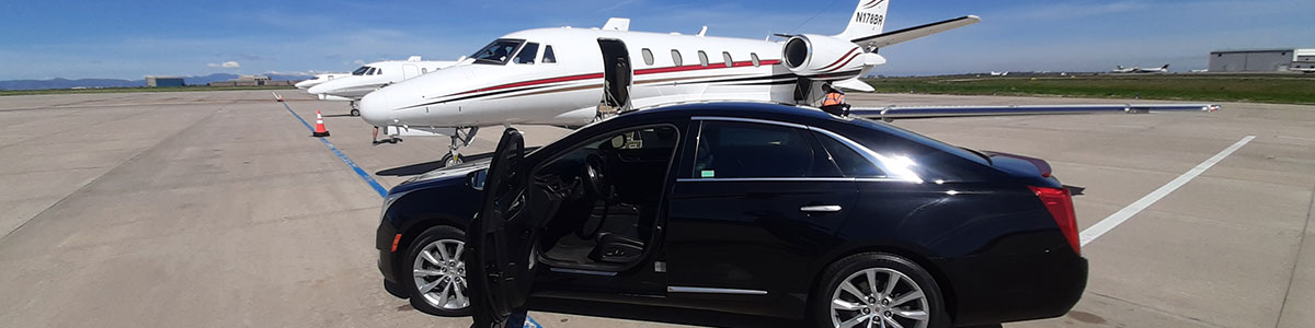 A black car and a white jet airplane