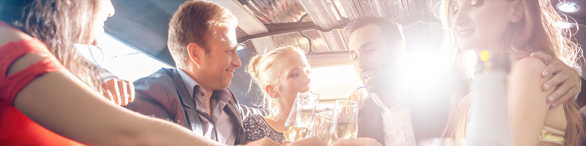 A group of people sitting around drinking wine.